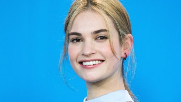 epa04617767 British actress Lily James poses during the photocall for &#039;Cinderella&#039; at the 65th annual Berlin International Film Festival, in Berlin, Germany, 13 February 2015. The movie is presented out of competition at the Berlinale, which runs from 05 to 15 February 2015. EPA/MICHAEL KAPPELER