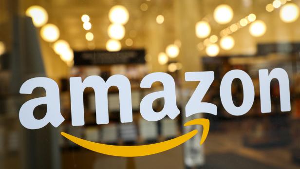 FILE PHOTO: The logo of Amazon is seen on the door of an Amazon Books retail store in New York