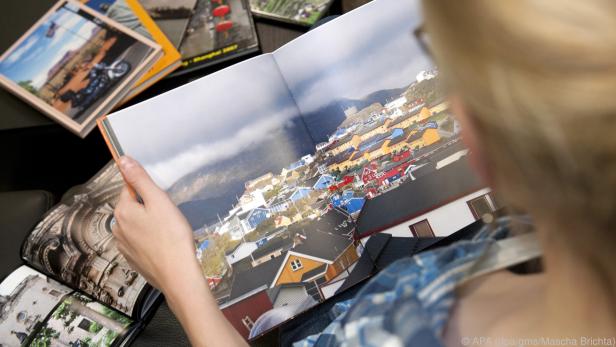 Fotobücher voller Erinnerungen sind ein beliebtes Weihnachtsgeschenk