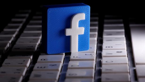 FILE PHOTO: A 3D-printed Facebook logo is seen placed on a keyboard in this illustration