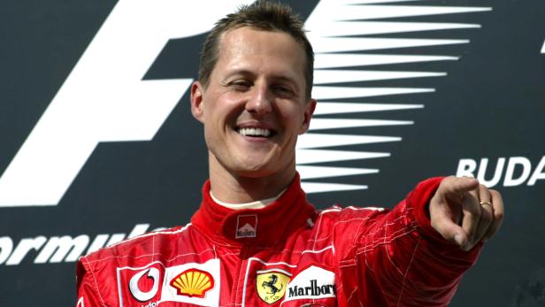 FILE PHOTO: Michael Schumacher - Ferrari celebrates winnning the race