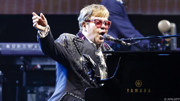 Elton John sang "Don't Let the Sun Go Down on Me"